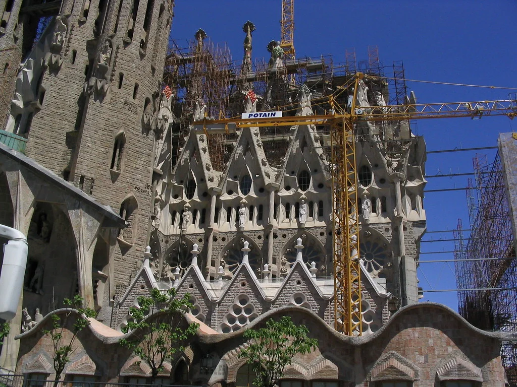 Sagrada Família: A basilica view with branching towers, dense ornament, and coloured light.